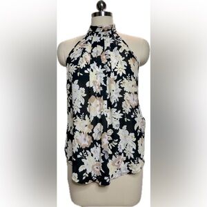 Black floral print blouse. Small.